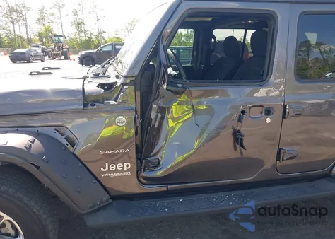 2022 Jeep Wrangler Unlimited Sahara 4X4 z USA, uszkodzony, nr VIN 1C4HJXEN2NW194502